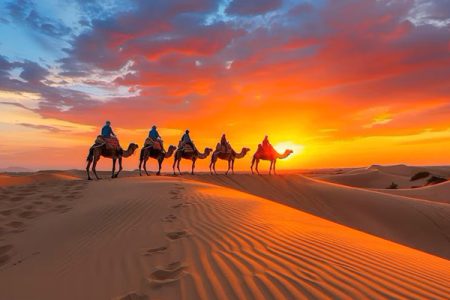 people-riding-camels-desert-sunset